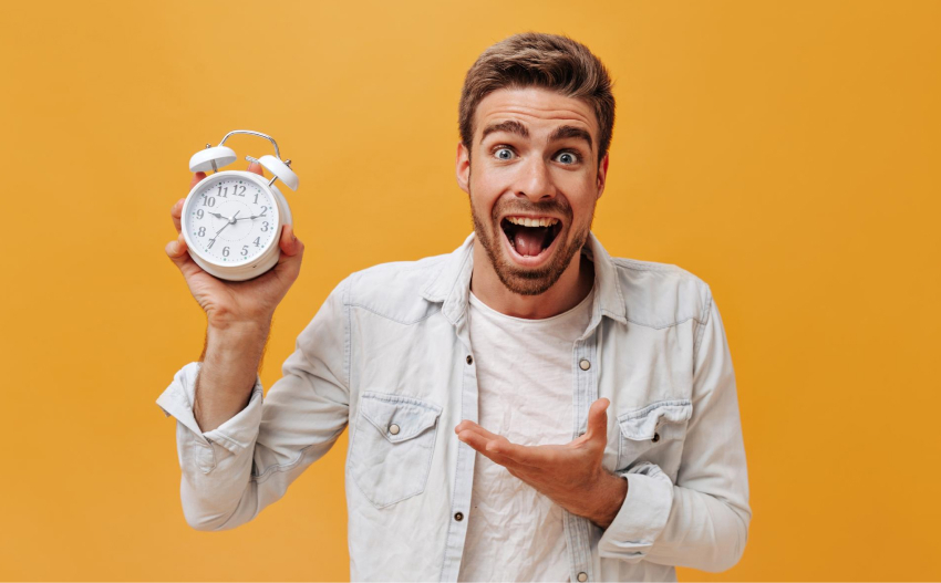 gamification for lead generation: Excited Man Holding Alarm Clock
