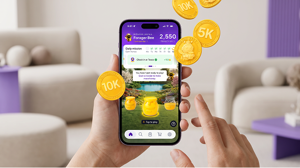 Customer playing the RunnyHoney rewards campaign on a mobile phone with HoneyCoins.